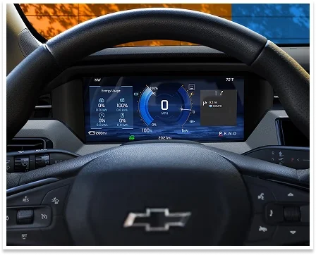 Close-up of the 2027 Chevrolet Bolt 11-inch driver information center displaying speed and battery status behind the steering wheel
