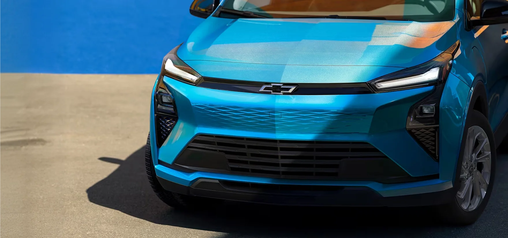 Front three-quarter view of the 2027 Chevrolet Bolt highlighting the redesigned front fascia and LED headlights