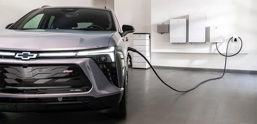 Chevrolet Bolt EV charging at home in a residential garage using a wall-mounted Level 2 charger