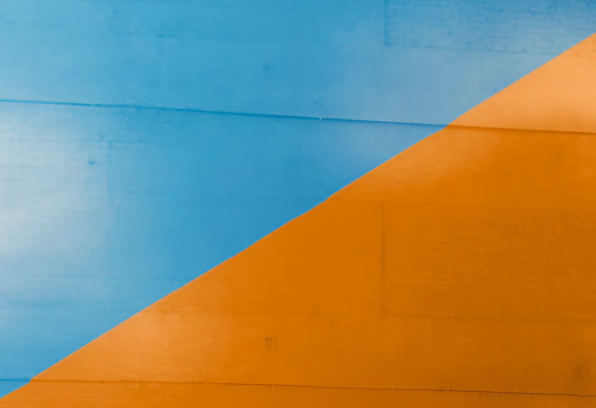 Gallery background image showing a collage of 2027 Chevrolet Bolt photos with a blue and orange color scheme